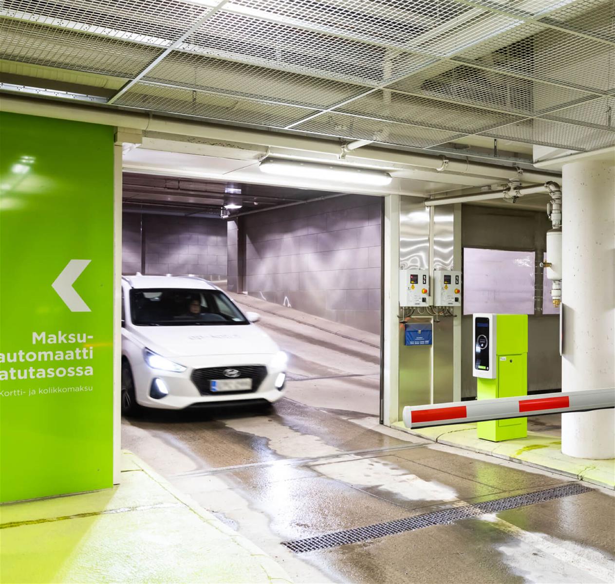 A car entering a parking garage.